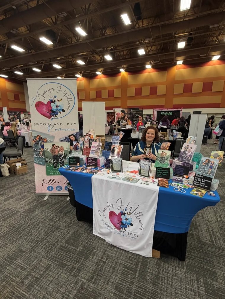 Author Jennifer J. Williams at her book convention booth