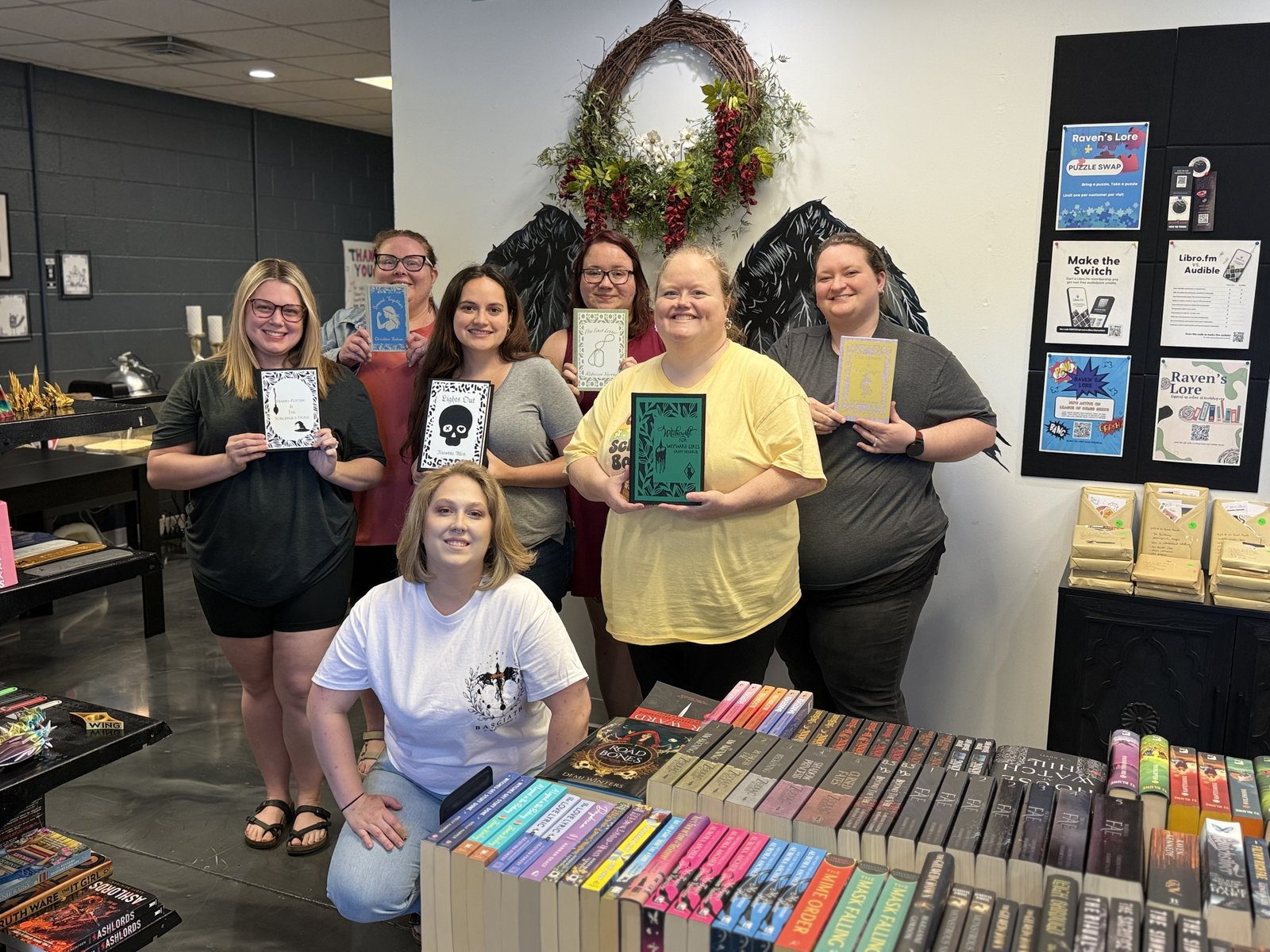 Book rebinding workshop hosted by Denise, attendees holding their finished rebinds